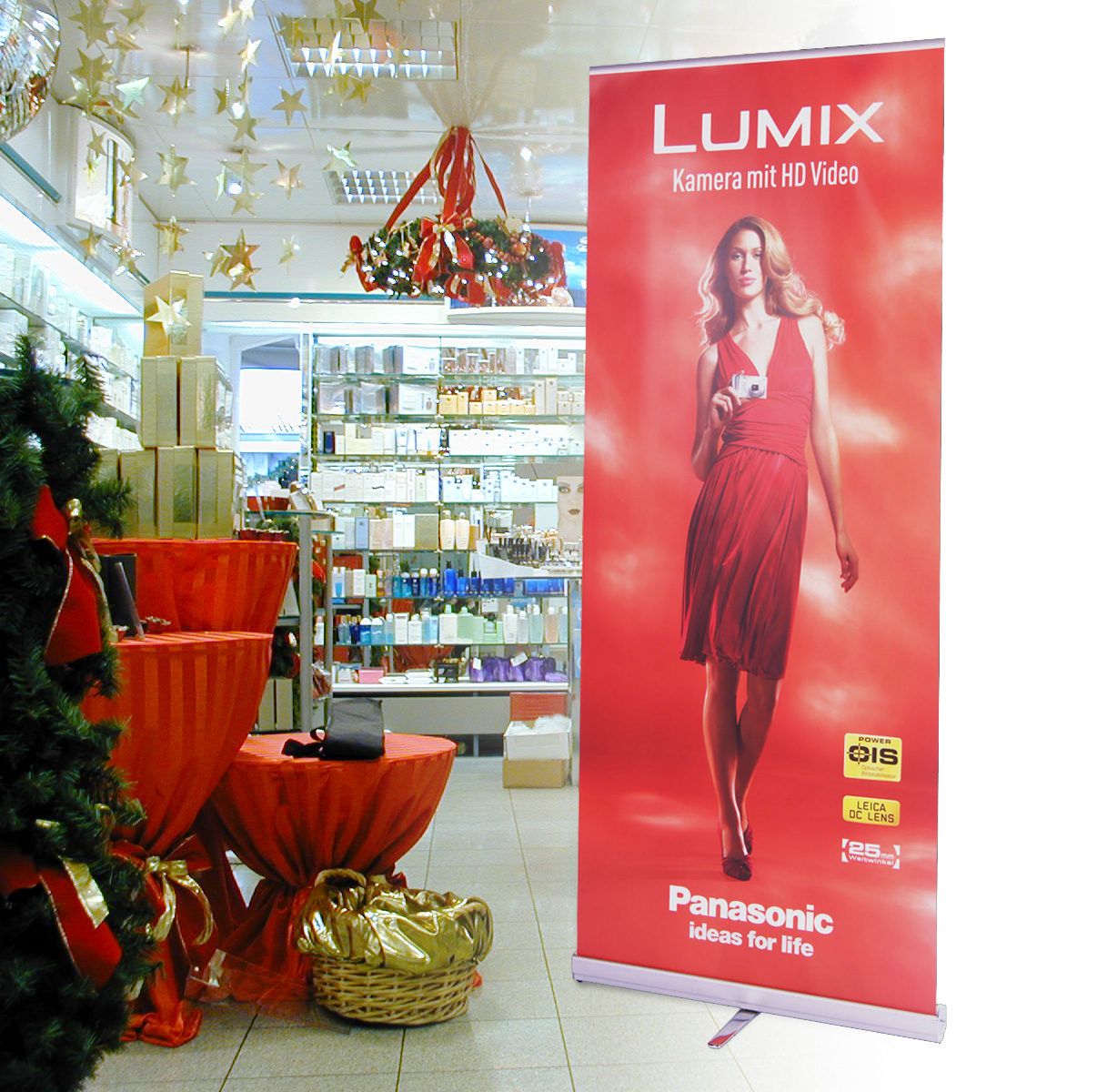 Roll-Up Banner im Design Panasonic mit Frau und Kamera